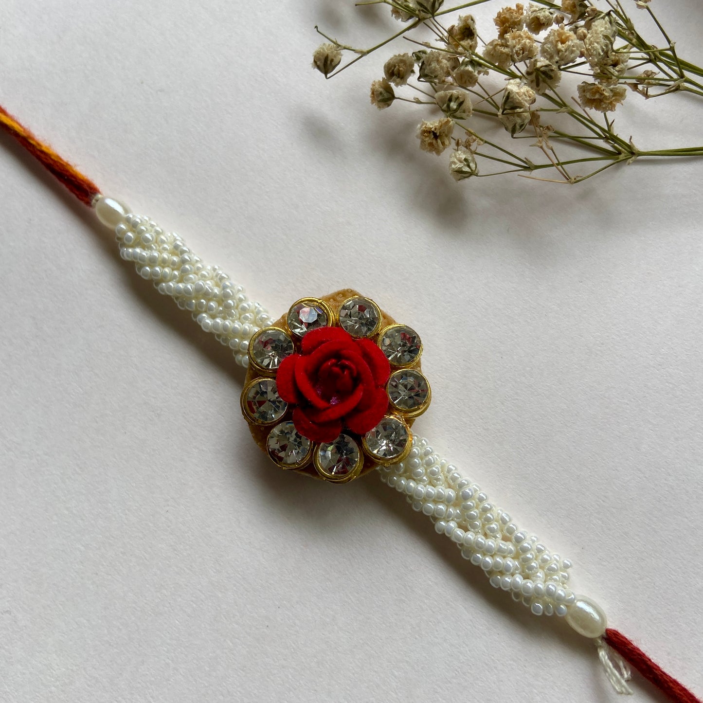 Rose White beads Rakhi