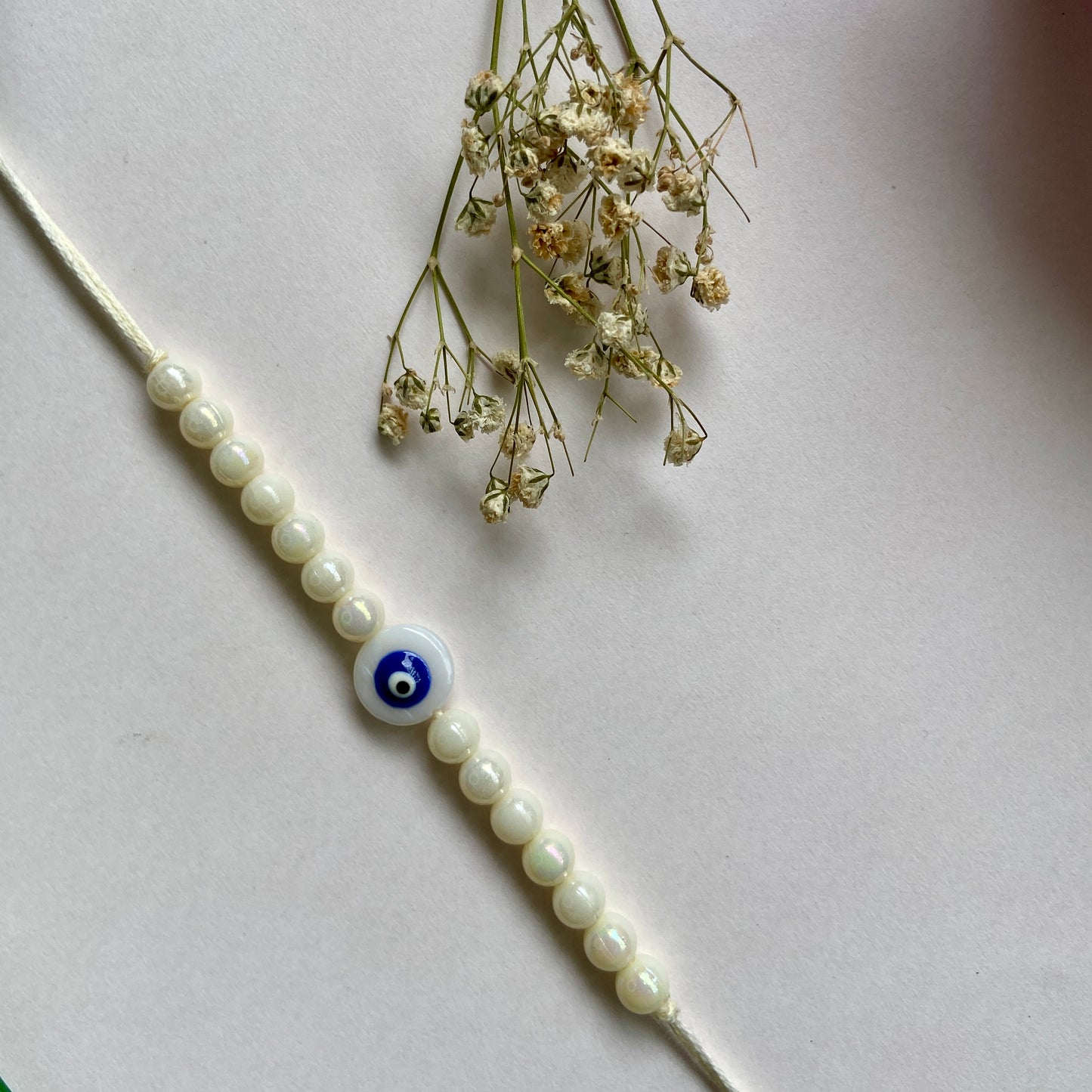 Evil Eye white beads Rakhi